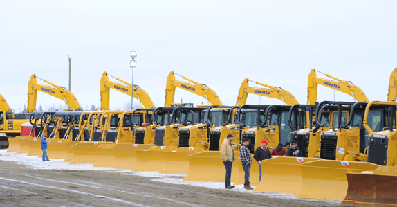 Dozers and excavators ready to sell at a Ritchie Bros. equipment auction in Canada